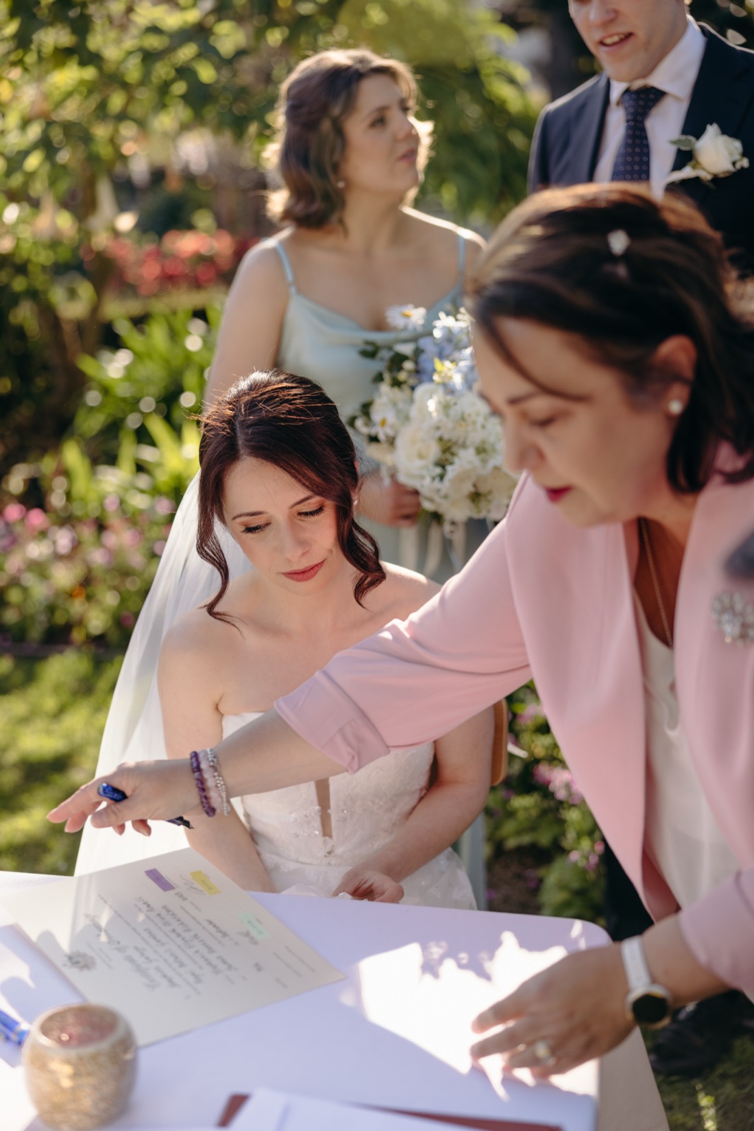 Josephine Galazzo guiding a bride through signing the marriage register