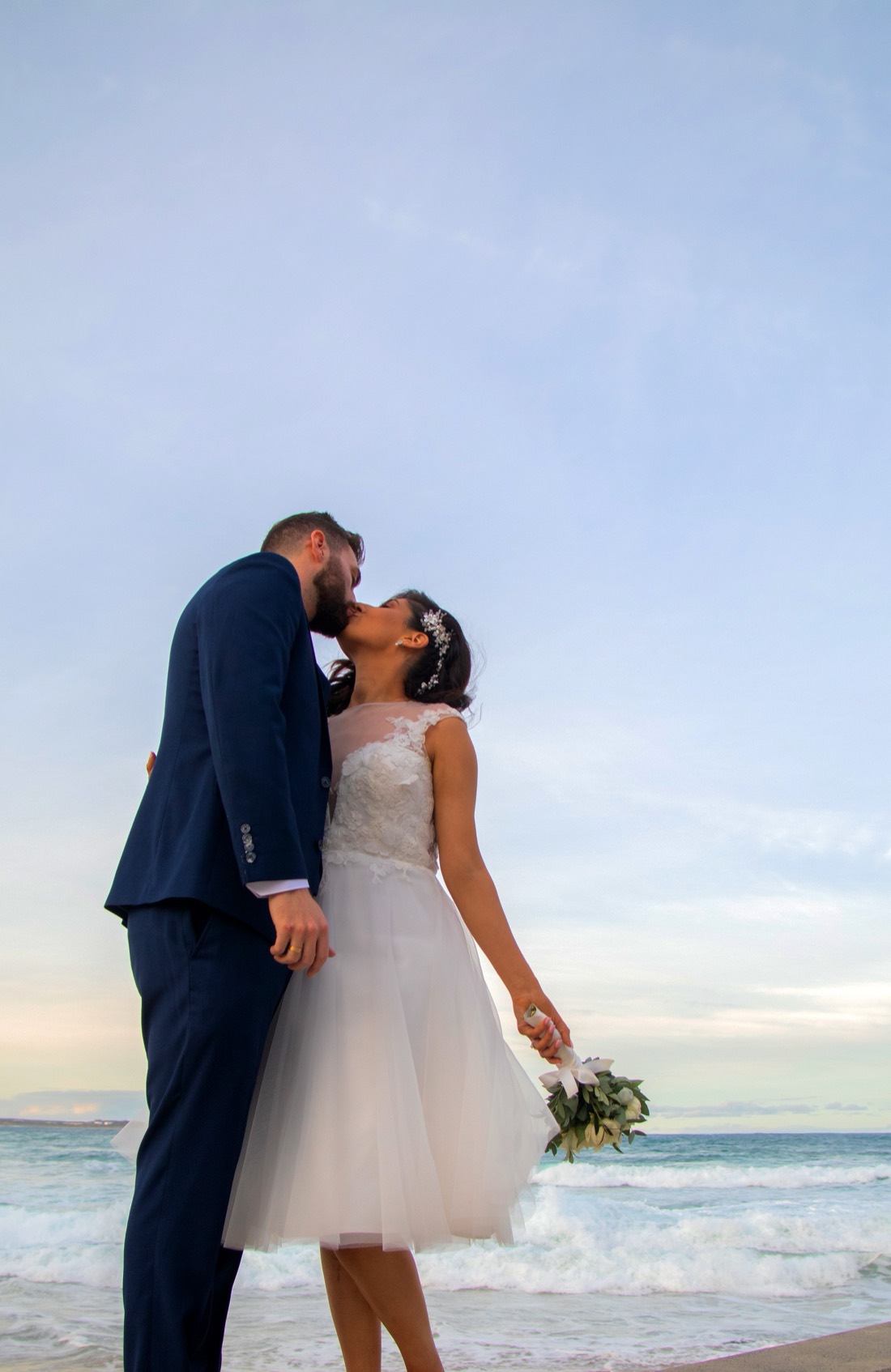 A couple together at sunset on the sand